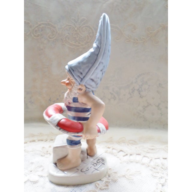 This is a Goebel 1972 Co Boy Figurine "Mark" in his swimming Trunks and Red Float that is 7.75" tall No Chips or Cracks...