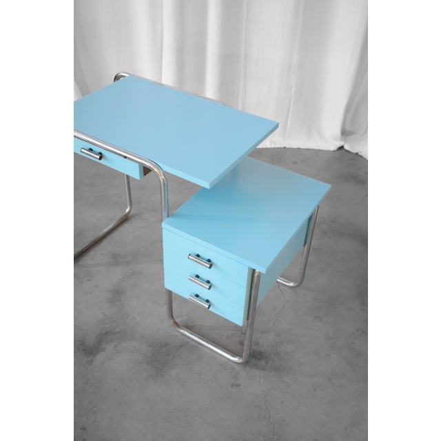 Functionalist table by Kovona, Czechoslovakia, 1950s. Features a chrome metal structure and a renovated tabletop in light...