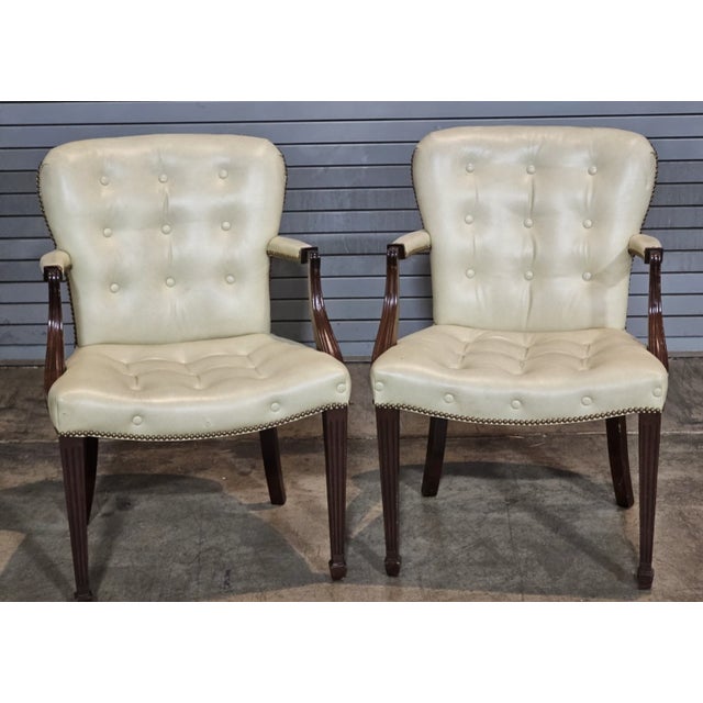 Store Item: PAIR OF Hickory Chair Mahogany Tufted Yellow Leather Open Arm Chairs Description: Chairs feature a shaped...
