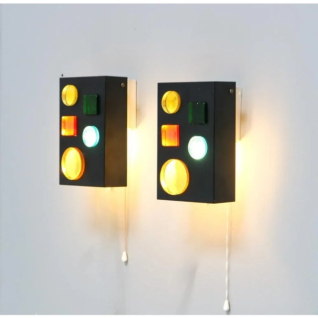 Stunning and rare pair of Mid-Century Modern wall lights objects. Design by Raak Amsterdam. Model: Alchemy 1968. Striking...