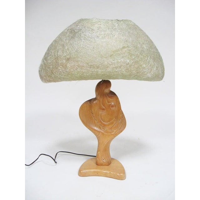 This sensuous table lamp executed in wood is an abstracted female figure. The form works in perfect symphony with the...
