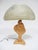 This sensuous table lamp executed in wood is an abstracted female figure. The form works in perfect symphony with the...