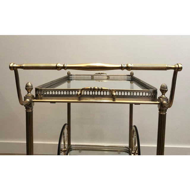 This very nice neoclassical style bar cart is made of silvered brass. This is a French work bt famous designer Maison...