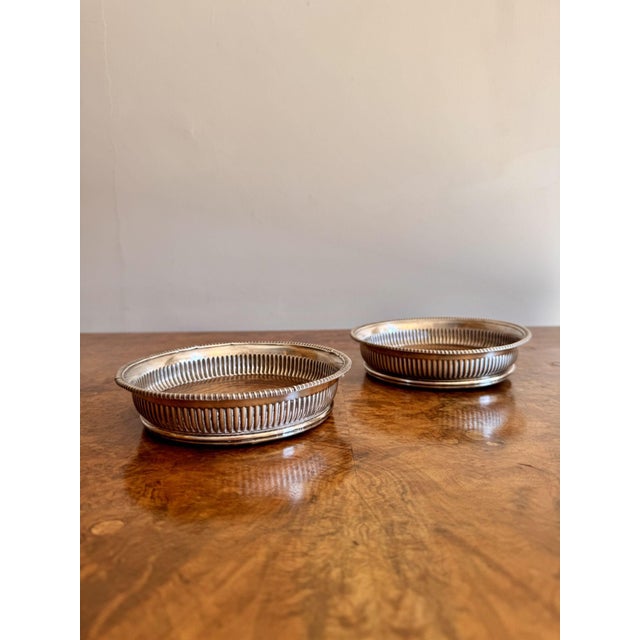 Quality pair of antique Victorian wine coasters, having a quality pair of antique Victorian wine coasters with an embossed...