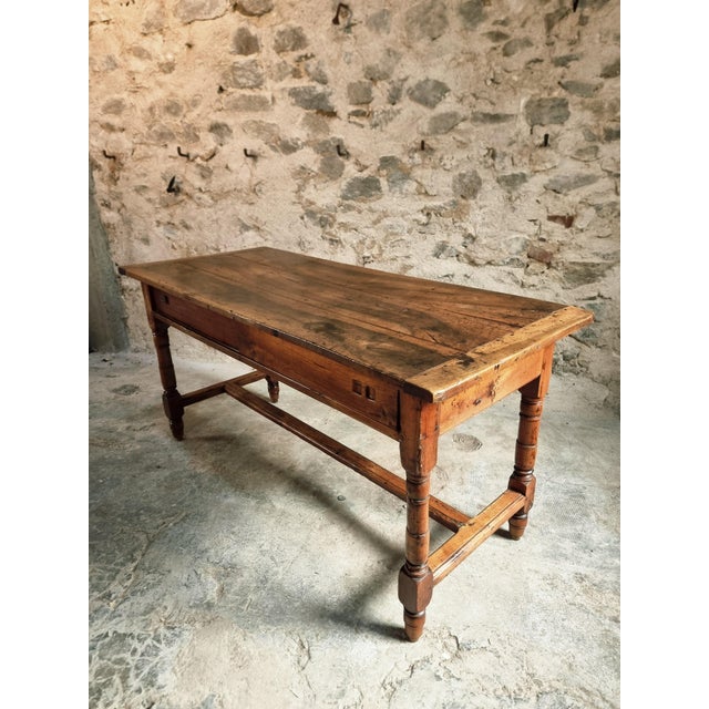 A 19th-century French Louis Philippe table, combining understated elegance with practical functionality. Crafted with a...