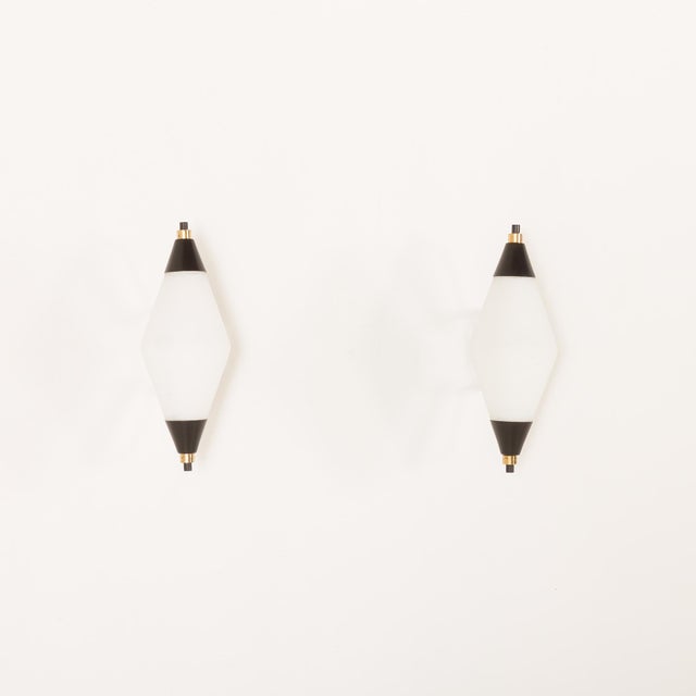 This pair of large, elegant mid-century wall lights was made in italy in the 1960s. Due to the quality of manufacture and...