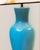 Pair of lamps with glazed ceramic bodies shaped like delicate vases. Gold-plated brass bases. Custom-made pagoda-shaped...