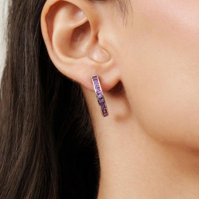 Elevate your everyday style with these elegant 925 Sterling Silver Amethyst Hoop Earrings. Designed with a sleek and...