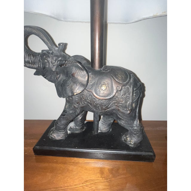 Elevate your space with this majestic vintage Hollywood Regency figural elephant table lamp by the esteemed Berman...