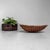 Decorative vintage Japanese bamboo basket, dating from the 1950s–1960s. The basket has a low, wide form with gently curved...