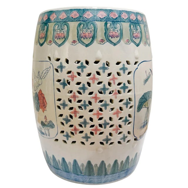 A vibrant green and pink vintage Chinese porcelain garden stool featuring beautiful lotus flowers, dragonflies, cranes,...