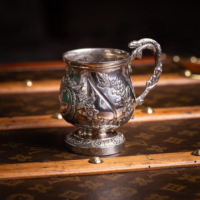 Antique 19th Century Indian colonial silver christening mug, of rounded bellied form with wrythen fluting, decorated with...