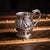 Antique 19th Century Indian colonial silver christening mug, of rounded bellied form with wrythen fluting, decorated with...
