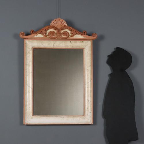 Lacquered wood mirror, carved scrollwork cymatium with a central shell. Italy, 19th century. This piece is attributed to...