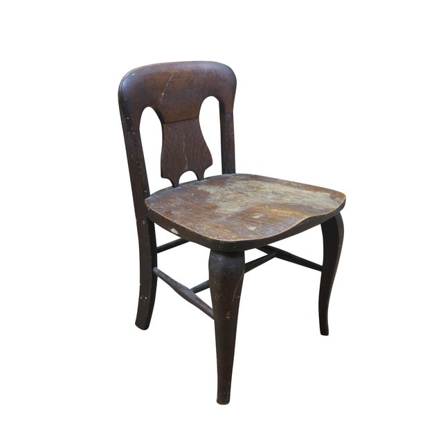 Antique Victorian child or doll sized chair. Made of quartersawn oak featuring a unique splat back design with formed seat...