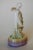Art Deco Porcelain Floral Dancing Female Figurine Made In Germany. Numbered 3944. Measures 7.5" High x 4" Wide x 2.5" D