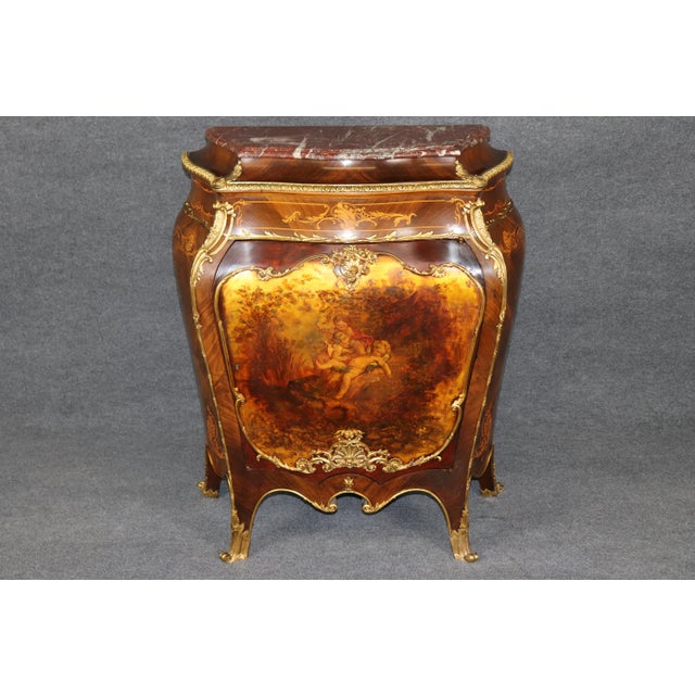 This exceptional Louis XV-style bombé commode is a particularly sumptuous example of the French decorative tradition,...