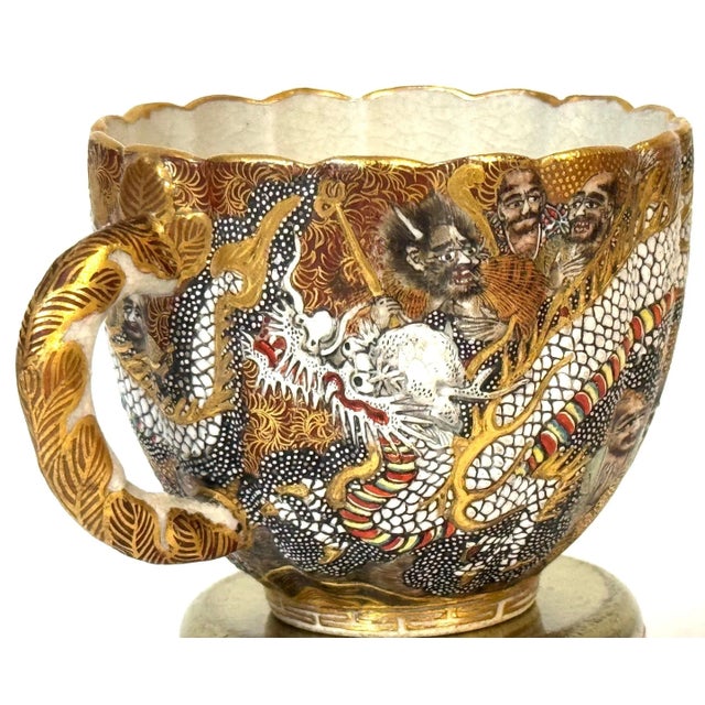 Meiji Satsuma Cup and Saucer by Kitagawa-zō with Dragons and Immortals, Signed Dai Nippon An extraordinary Meiji-period...