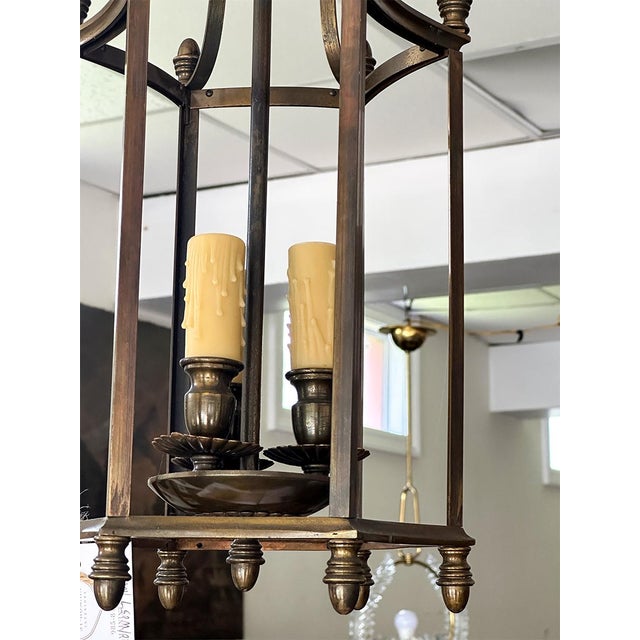 Striking in form and finish, this pair of bronze hanging lanterns brings timeless sophistication to any entryway, hallway,...