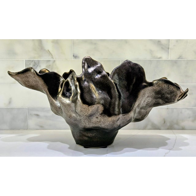 Iconic Global Views Meteor Bowl in the medium 22" size, handcrafted in glazed ceramic and made in Portugal. Its dramatic,...