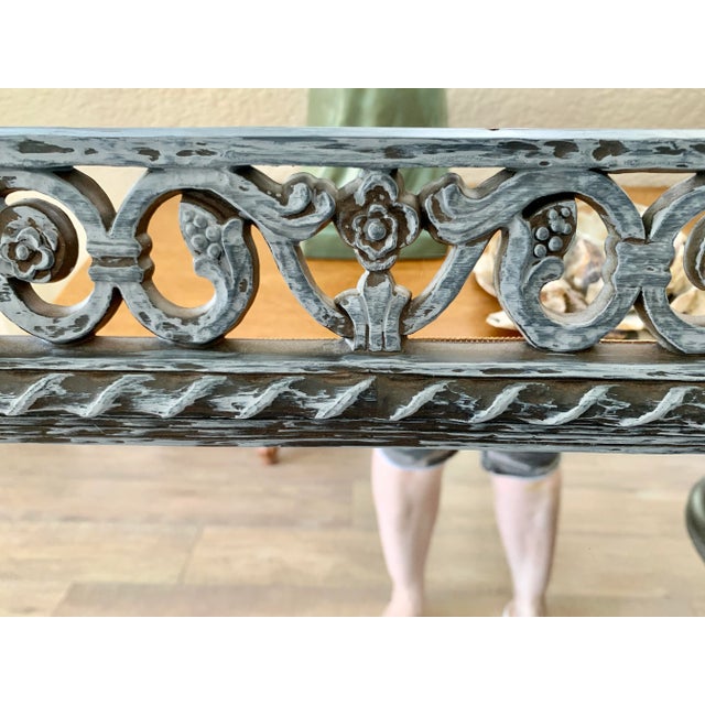 Large lovely rustic ornate wall mirror with cutout floral motif and gray blue wash of color over black vase. Can be hung...