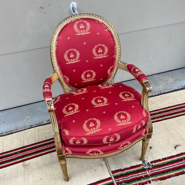 A Vintage Red Upholstered Painted Decorated and Carved French Bergere Arm Chair For Sale - Image 11 of 12