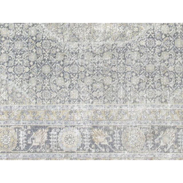 This lavish hand-knotted Persian Tabriz rug adds the perfect touch of elegance to any space. Its intricate design features...