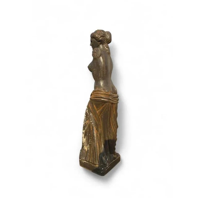 A striking mid-century interpretation of the iconic venus de milo, crafted in reconstituted stone during the 1950s. This...