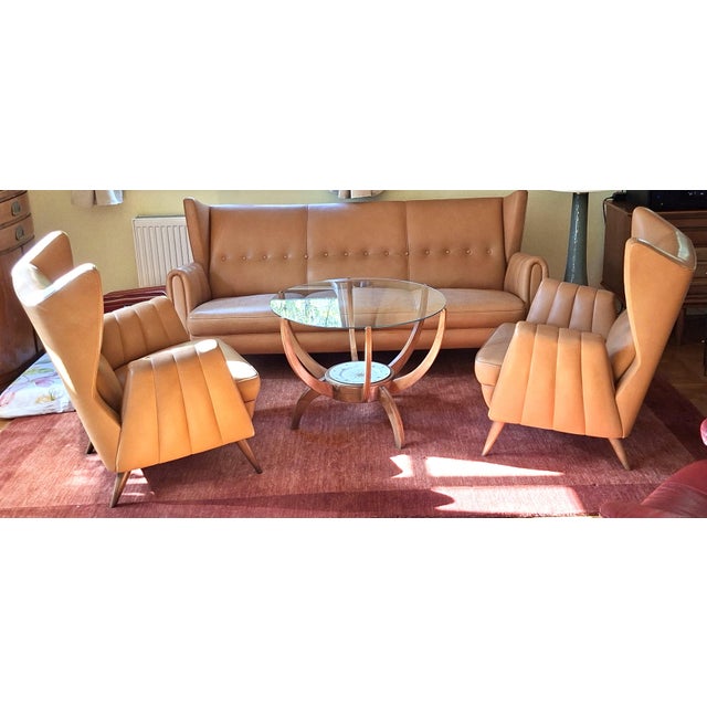 An exceptionally prestigious lounge suite upholstered in light brown leather, masterfully crafted. this suite was custom-...