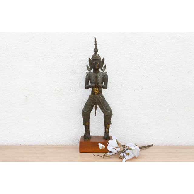 This is more than a statue; it's a living piece of spiritual art. This antique bronze figure, with a style consistent with...