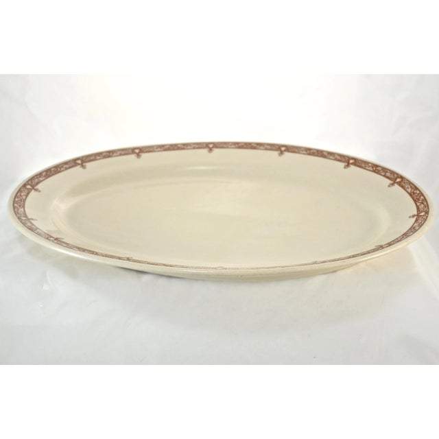 Large 15 inch vintage ivory platter with deep chestnut brown floral scroll pattern around the rim. Marked underside. Light...