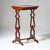 Small Biedermeier side table with a shallow drawer and shaped cut-out legs connected by a stretcher. The table has been...