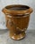 A monumental French Anduze style terracotta garden urn, richly glazed in a warm honey brown. The classical form features...