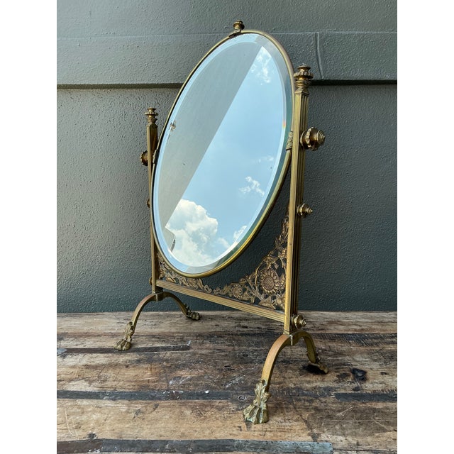 This exquisite 19th-century brass reliquary mirror is a rare artifact of Victorian elegance and sacred history. Originally...