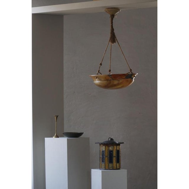 This exceptional art deco ceiling lamp is a rare French classical alabaster pendant dating to the early 20th century,...