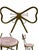 A charming vintage metal chair featuring an ornate bow-tie backrest frame and a round cushioned seat upholstered in soft...