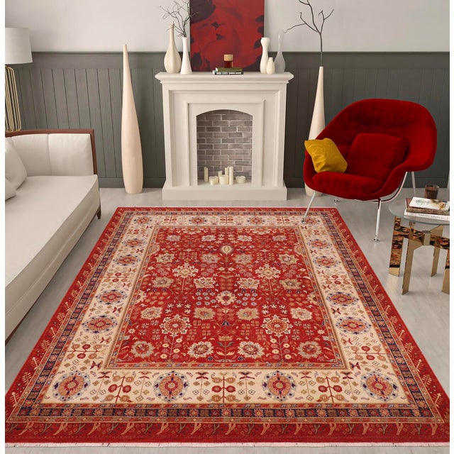 Enhance the ambiance of your home with this magnificent Persian-influenced Turkish hand-knotted rug made by skilled...