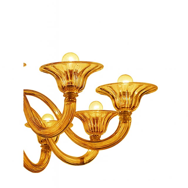 Elegant land linear chandelier in amber made in Murano glass and chromed metal frame. This is "rigadin"a traditional...
