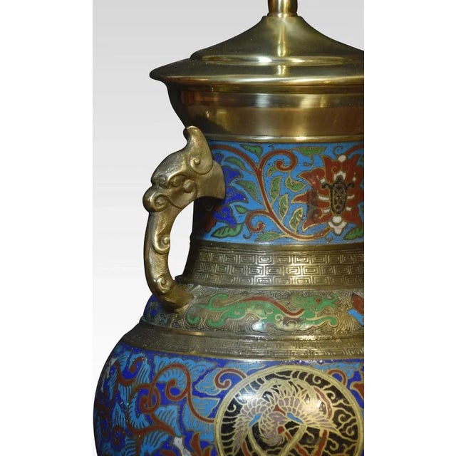 Chinese cloisonne twin-handled lamp base with panels of foliate motifs and roundels featuring dragons and phoenixes,...