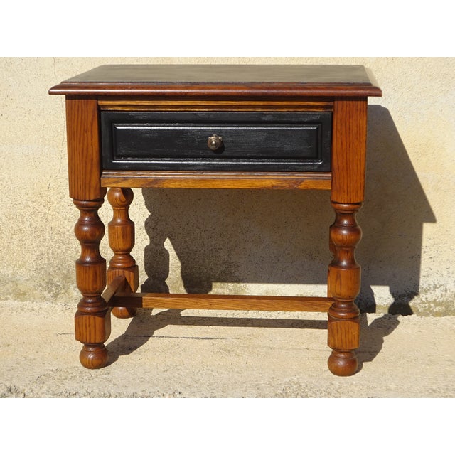 1980s bedside table with drawer. Wooden top with chamfered edges, painted and varnished in matte black. One drawer with a...