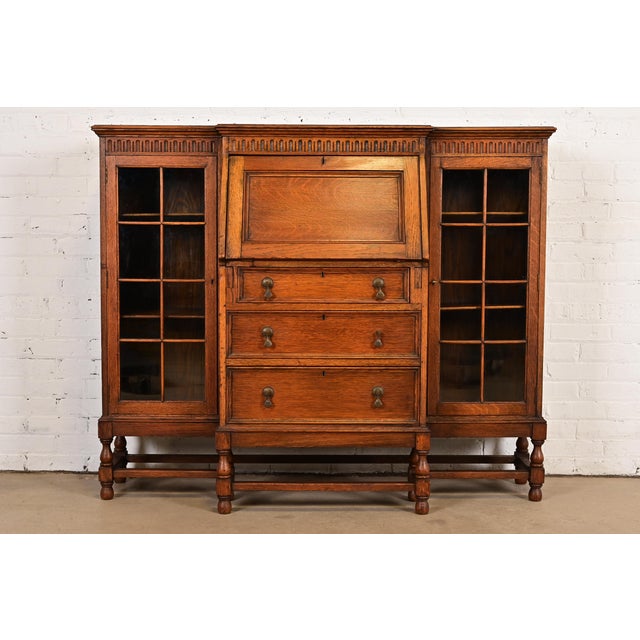 Antique English Jacobean Carved Oak Glass Front Double Bookcase With Bureau and Drop Front Secretary Desk, Circa 1920s For Sale - Image 14 of 14