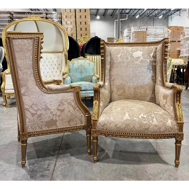 Elevate your interior with this exquisite Neo-Classical style Bergère wing chair, featuring a luxurious gold leaf frame...