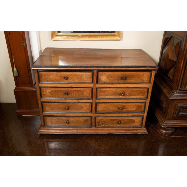 Tuscan Walnut Eight Drawer Commode with Ebonized Detail circa 1780 height: 34 in. (86 cm) width: 48 in. (122 cm) depth: 26...
