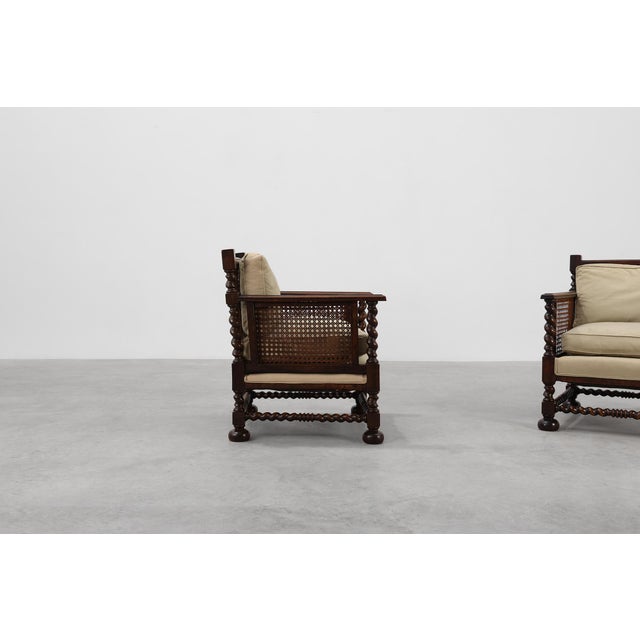 United Kingdom / 1880 / 2 armchairs / oak and rattan / English / Antique This elegant pair of English armchairs, dating...