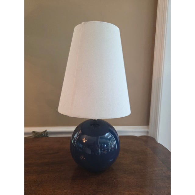 Kate Spade lamp in beautiful blue with original fabric shades. Lovely design with sphere base and elongated shades. All...