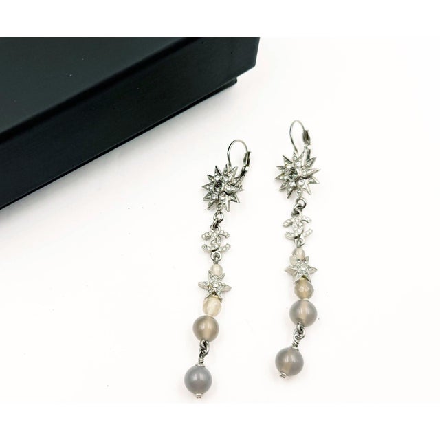 Chanel Silver Star CC Crystal Lavender Bead Long lever Back Earrings *Marked 15 *Made in France *Comes with the original...