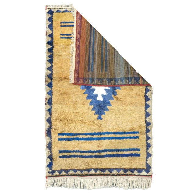 A boldly simple, tri-tone Moroccanesque scatter with a straw field and layered cerulean and cream ashik medallion. Two...