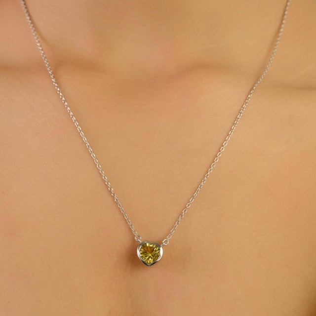 Embrace simplicity and elegance with this Minimalist 1.88 Ct Heart-Shaped Lemon Quartz Pendant. Expertly set in 925...