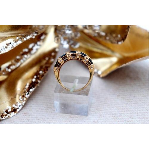 Gold ring with brilliant-cut diamonds (64) and calibrated Australian sapphires. Metal: Gold. Origin: Italian. Brand:...