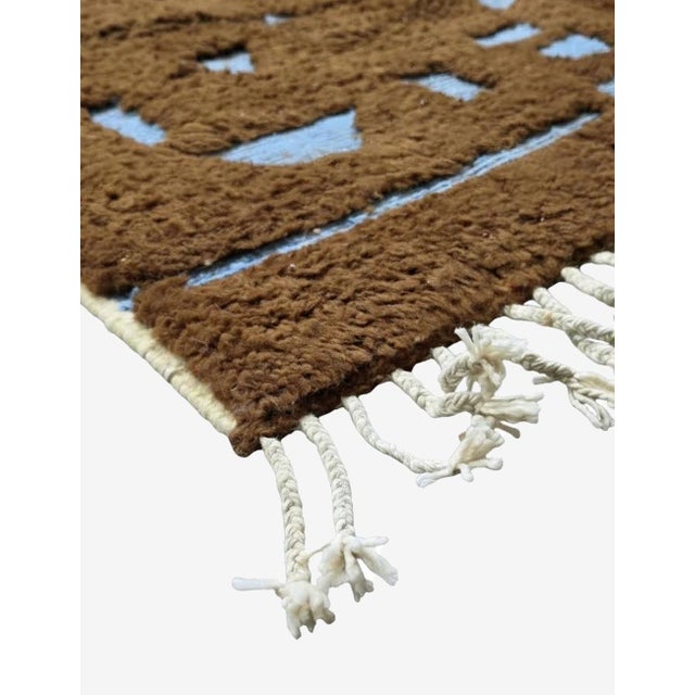 Chocolate Brown Moroccan Rug – Handmade Contemporary Berber Wool Carpet This sophisticated handmade Moroccan rug features...